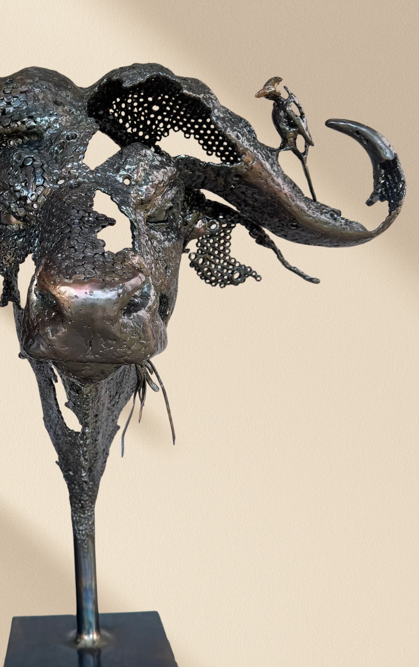 buffalo metal sculpture in a gallery